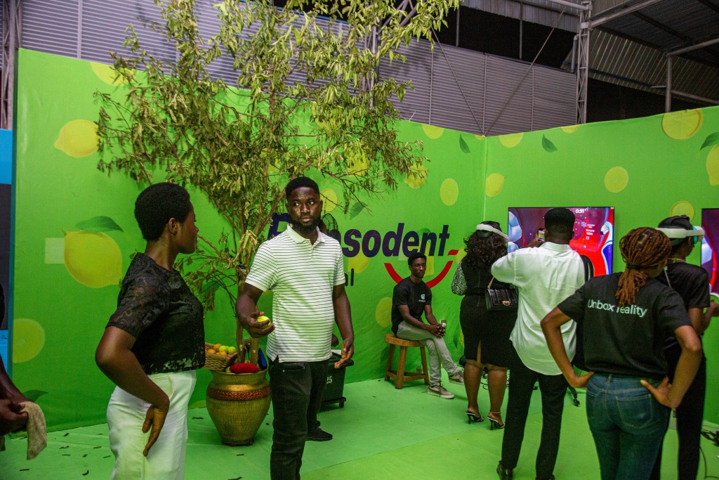 Guests gathered in a green garden-themed activation space with Pepsodent branding